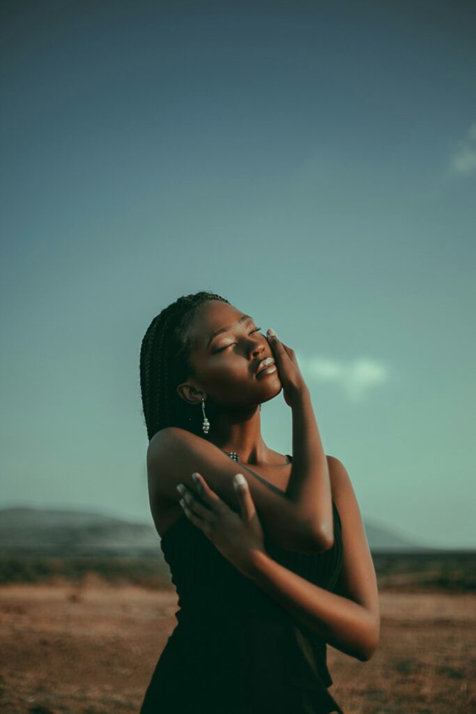 A woman hugs herself. Her husband and calm, content countenance represent self love. 

Photo Credit: https://unsplash.com/photos/womans-face-FjvXUeYf1AA?utm_source=unsplash&utm_medium=referral&utm_content=creditShareLink